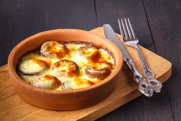 Mushrooms baked in a clay dish