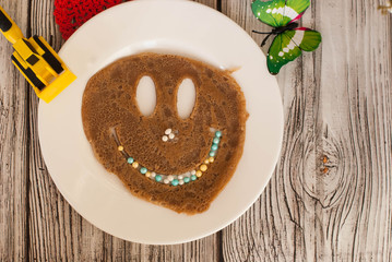 chocolate pancake with a smile