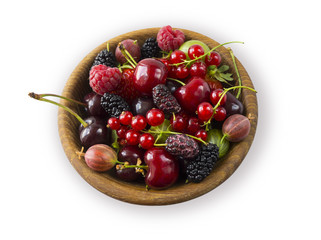 Top view. Ripe currants, raspberries, cherries, strawberries, gooseberries, blackberries, mulberries, gooseberries. Background of mix fruits with copy space for text. Mix berries isolated on a white 