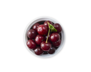 Fresh red cherries lay on white isolated background with copy space. Background of cherries. Ripe cherry on a white background. Cherries with copy space for text. Top view.
