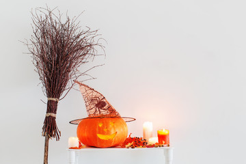 Halloween decorations on  wooden shelf