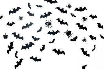 Picture of a lot of black bats and spiders on a white background