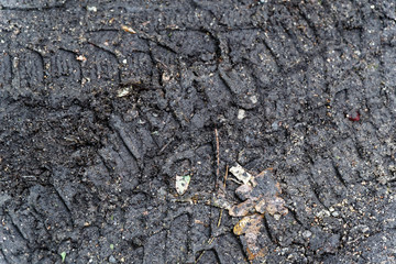 Tyre track on dirt mud, retro grunge tone on sand, off road track