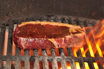 Marinated steak on the grill