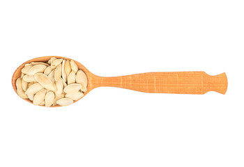 Pumpkin seeds in a spoon