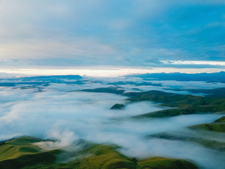 Aerial view from the drone. The peaks of the North Caucasus mountains in the morning fog at dawn.