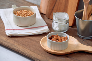 Kitchen still life with nuts and utensils