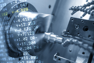 The abstract scene of CNC lathe machine or turning machine and the NC data  cutting the thread at...