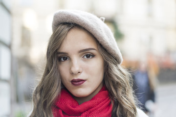 emotions, people, beauty and lifestyle concept - Girl Frenchwoman. Street photo of young woman wearing stylish classic clothes. Female fashion concept. French style. Cute teenage girl.