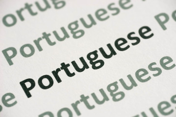 Fototapeta premium word Portuguese language printed on paper macro