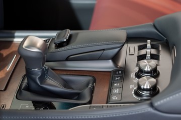 Interior of new modern car with automatic transmission. Passenger compartment finish with genuine leather.