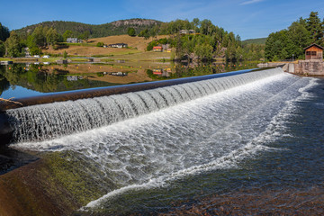 Old dam on the picturesque Telemark canal. Touristic attraction surrounded by pastoral countryside...