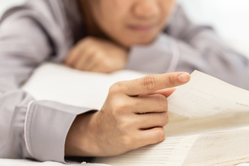 Close up hand of woman open book to reading,Selective focus,Education Concept