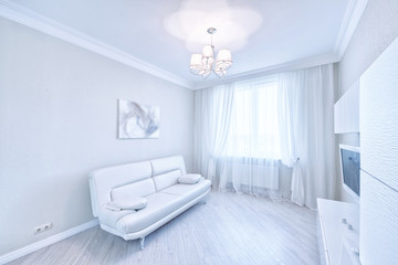 The interior of a modern apartment in white.