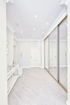 The interior of a modern apartment in white.