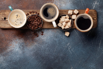 Coffee cups, beans and brown sugar