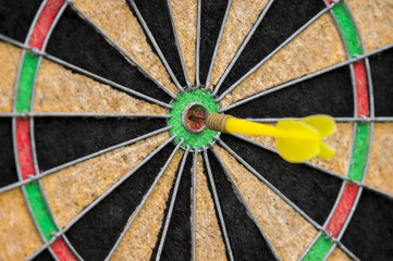 Dart hitting the center of target. Marketing concept