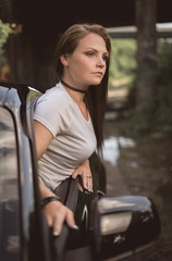 Fototapeta na wymiar Young Woman in Car