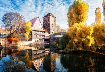 Old town of Nuremberg with half-timbered houses over Pegnitz river, Germany at fall, retro toned