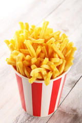 Potatoes French Fries in Red and white Carton Package Box. Fast Food.