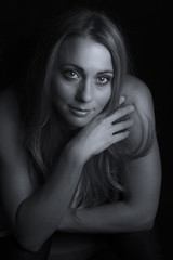 Obraz premium Beautiful woman emotional portrait in low light artistic conversion