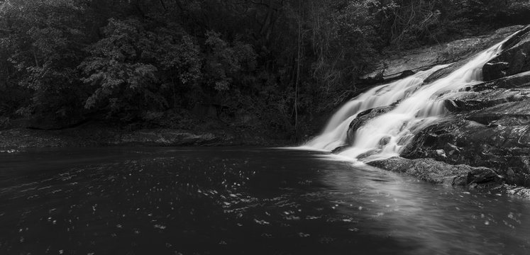 River flowing over rocks and the Debengeni Waterfall artistic conversion