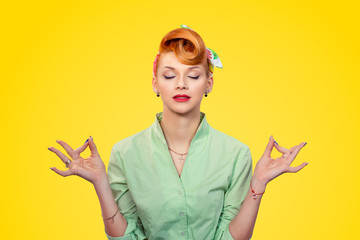 Young pinup girl meditating with eyes closed