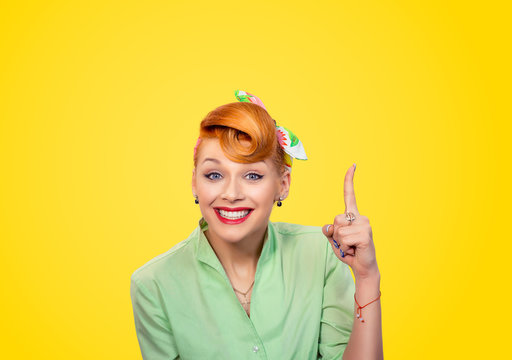 woman pointing finger up has a brilliant idea
