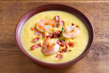 Creamy corn vegetable soup with shrimps and bacon