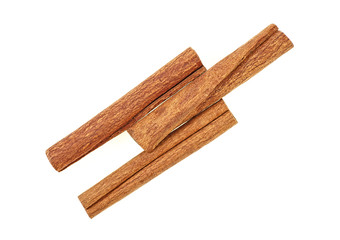 Three cinnamon sticks on a white background. Spices.