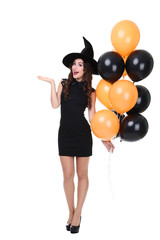 Young woman in halloween costume with balloons isolated on white background