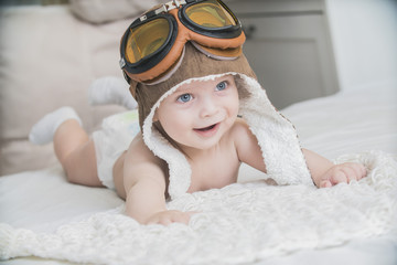 the baby is dressed as a pilot