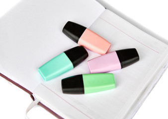 School materials set with coloring marker pens and notebook. Isolated in white background. Educational elements for back to school designs.