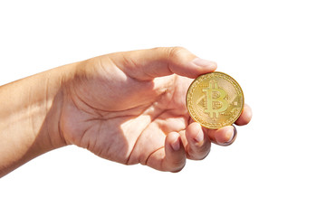 Woman’s hand holding golden Bitcoin on white background. Isolated on white. Business concept.