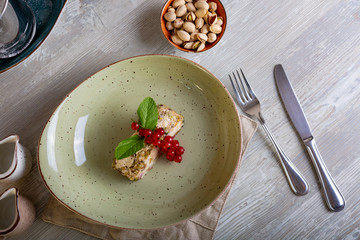 Close up view of beautiful elegant sweet dessert served on the plate. Beautiful decoration, restaurant dish, ready to eat. Tea time, cozy atmosphere.