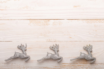 Silver christmas gifts on white wooden background. Top view. Copy space