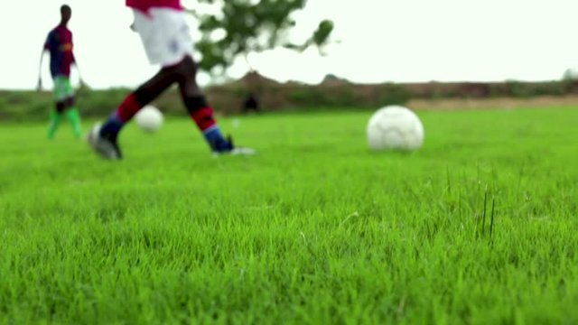 Kids Kicking Around a Soccer Ball