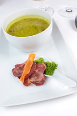 onion soup with bacon and vegetables on a white background