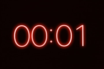 Digital clock timer stopwatch display showing 1 one second remaining in glowing red numbers....