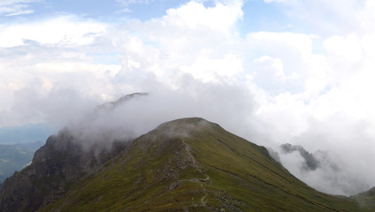 Mountain scenery with white clouds - Romania, Bucegi