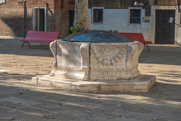 ancient well to gather rainwater on the island of Venice, Italy