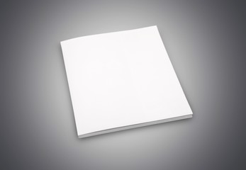 Blank book cover on black wooden  background