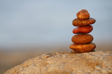     Zen like summer background, stones on the rock at the beach 