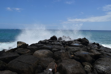 Fototapeta na wymiar Boulders and Crashing Waves