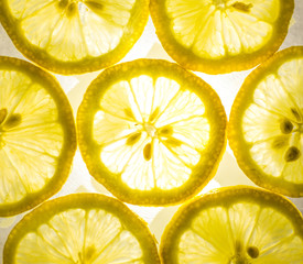 Top view of bright yellow lemon slices