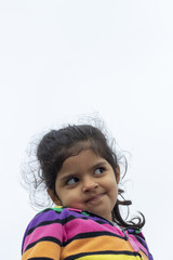 Little girl making gestures with her face