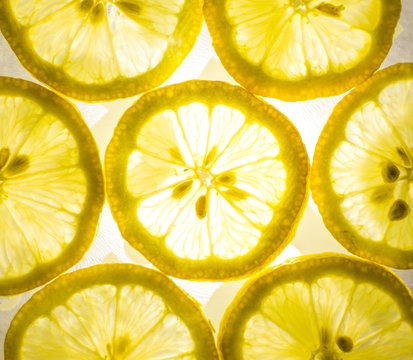 Top view of bright yellow lemon slices