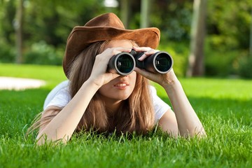 Portrait of a Woman Using Binoculars in a Park