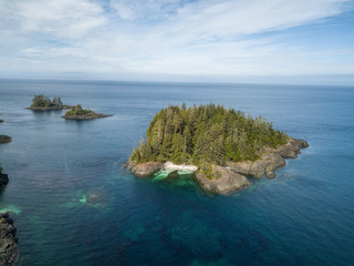 Aerial landscape of a rocky coast during a vibrant summer day. Taken on the Northern Vancouver Island, British Columbia, Canada.
