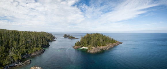 Aerial panoramic landscape of a rocky coast during a vibrant summer day. Taken on the Northern Vancouver Island, British Columbia, Canada.